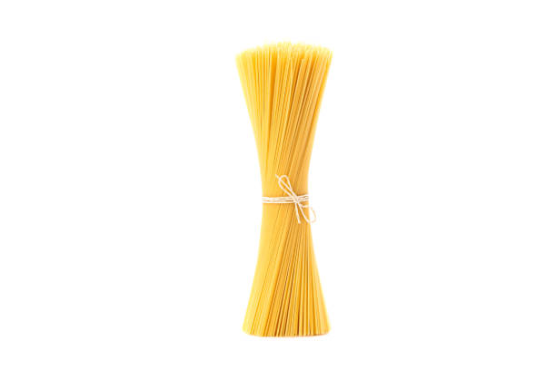istock Pasta isolated on white background. Uncooked whole wheat pasta 1152163597