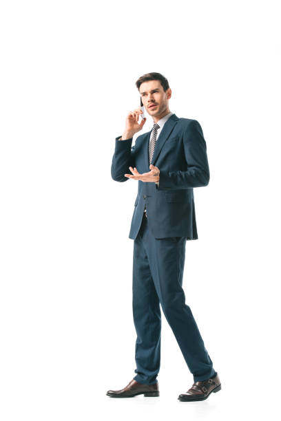 istock confused businessman in suit talking on smartphone isolated on white 1152166277