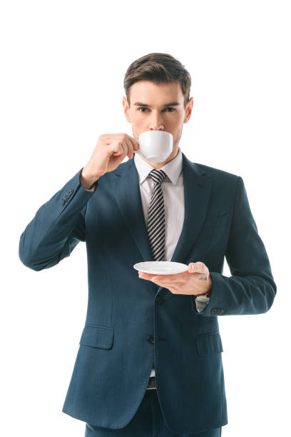 istock businessman in suit drinking coffee isolated on white 1152166289