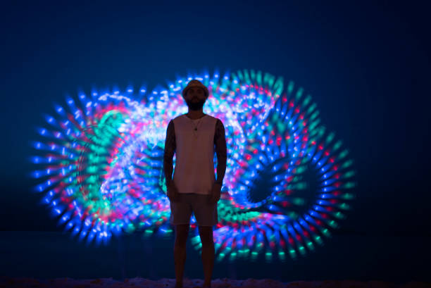 istock Young man standing in front of long tail light 1152167317