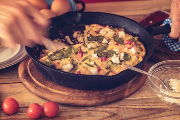 istock Frittata with baby spinach, bell peppers, cherry tomatoes and goat cheese 1152168165