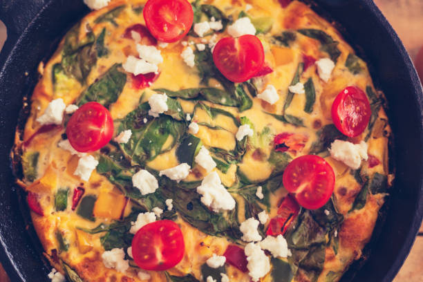 istock Frittata with baby spinach, bell peppers, cherry tomatoes and goat cheese 1152168322