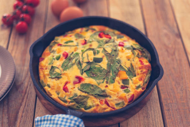 istock Frittata with baby spinach, bell peppers, cherry tomatoes and goat cheese 1152168390