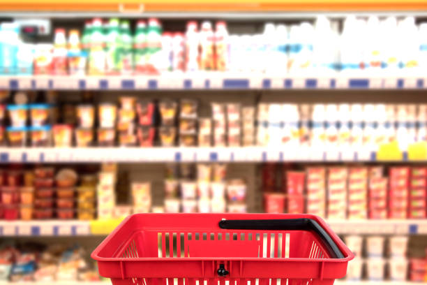 Abstract blurred photo of store with basket in department store bokeh background. business concept. stock photo