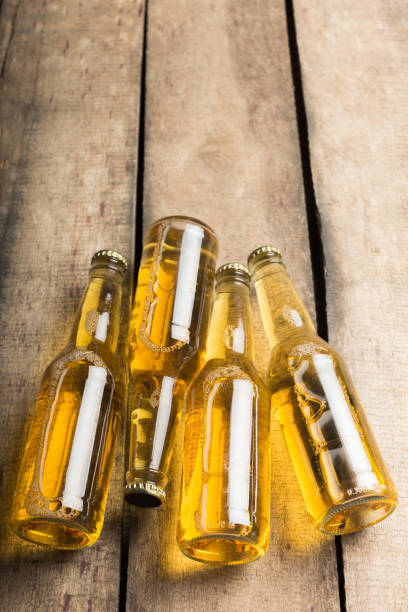 istock Beer bottles on a wooden table . 1152171266