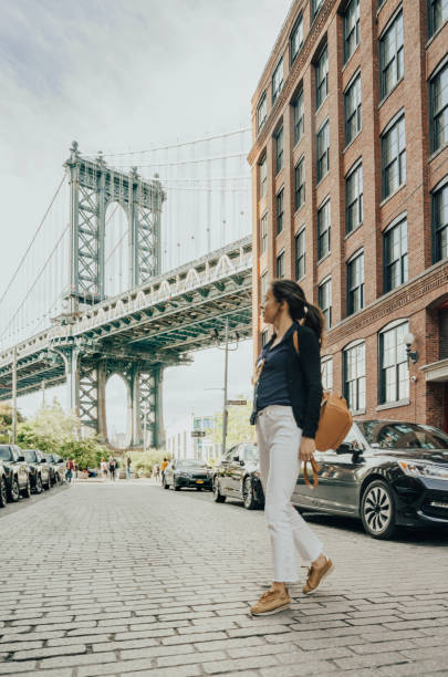 istock Woman with Manhattan Bridge in the background 1152172909