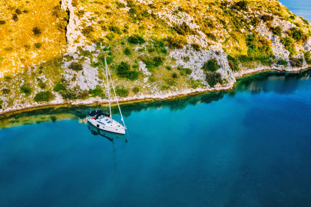 istock Anchored sailboat, view from drone 1152174845