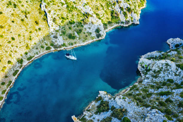 istock Anchored sailboat, view from drone 1152174873