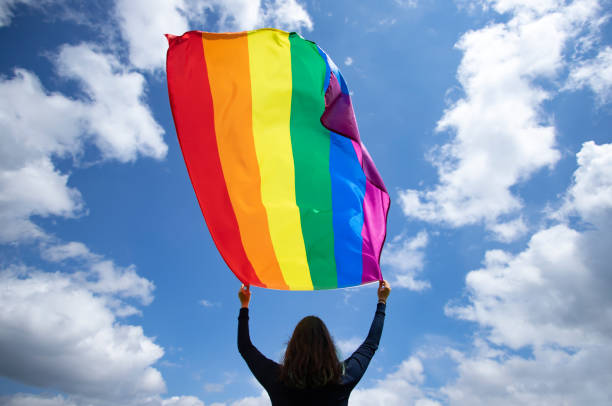 istock Young woman with LGBT flag. 1152176640