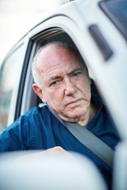 istock Frustrated senior man driving car looks at camera 1152177393