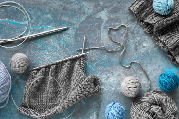 istock Wool yarn and knitting needles, creative knitting background in blue turquoise colors 1152179018