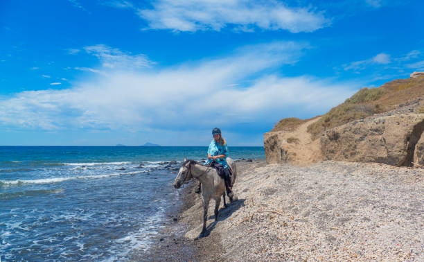 istock Horse riding on the beach in Santorini 1152179967