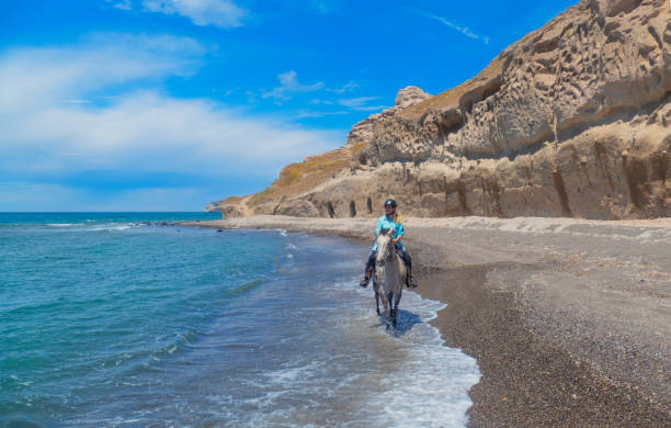 Horse riding on the beach in Santorini