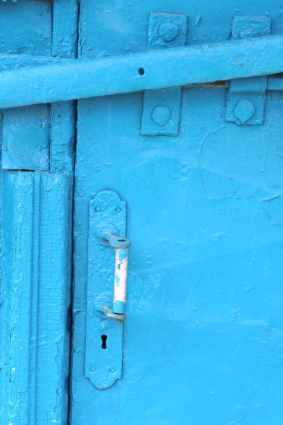 istock Old white door knob on blue background 1152180818