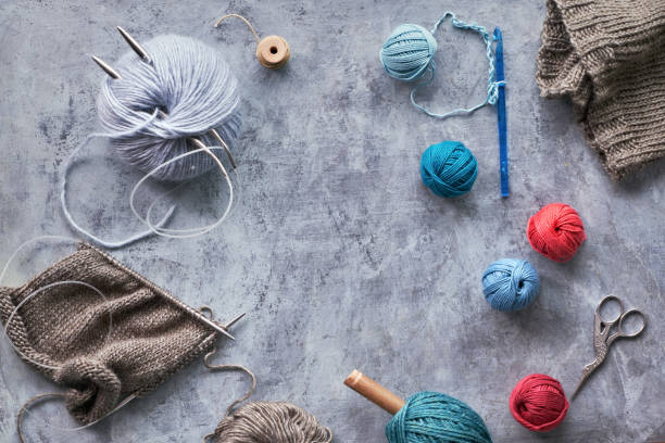istock Various wool yarn and knitting needles, knitting hobby background 1152181329