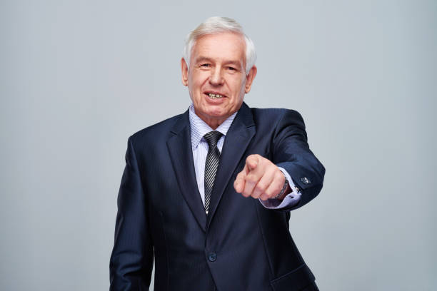 istock Senior businessman pointing at camera 1152181588