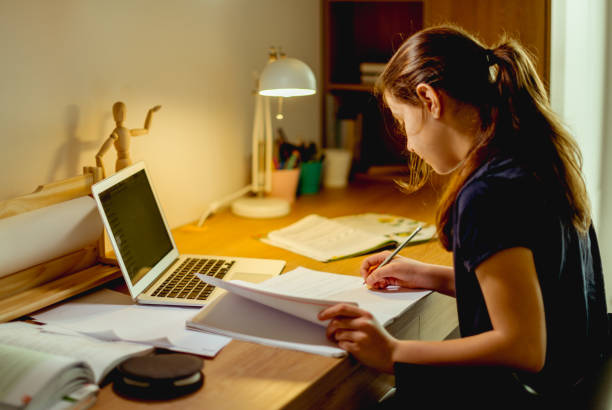 istock Teenager girl doing homework 1152182575