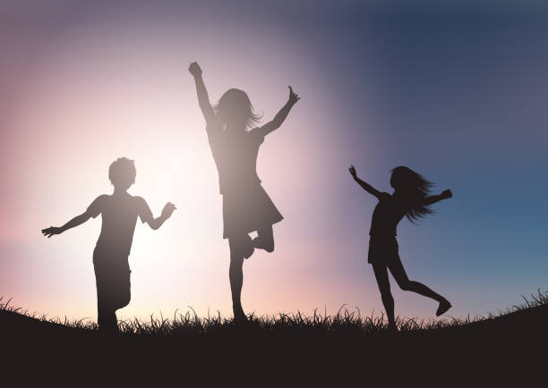 istock Silhouettes of children playing against sunset sky 1152182921
