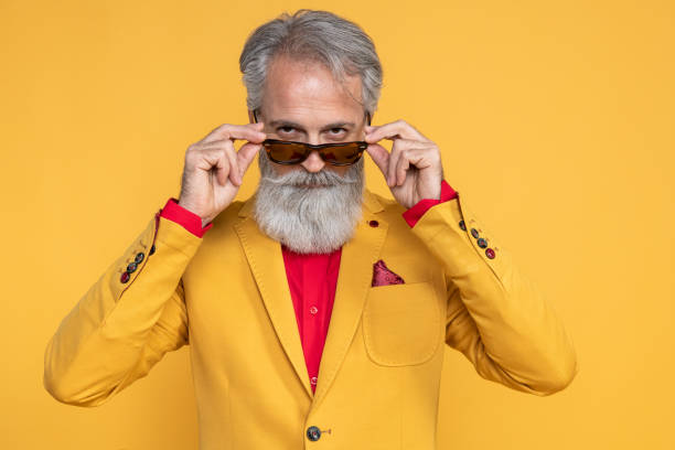 istock Happy well dressed gentleman having photoshooting in studio 1152183915