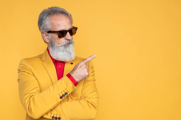 istock Happy well dressed gentleman having photoshooting in studio 1152183916
