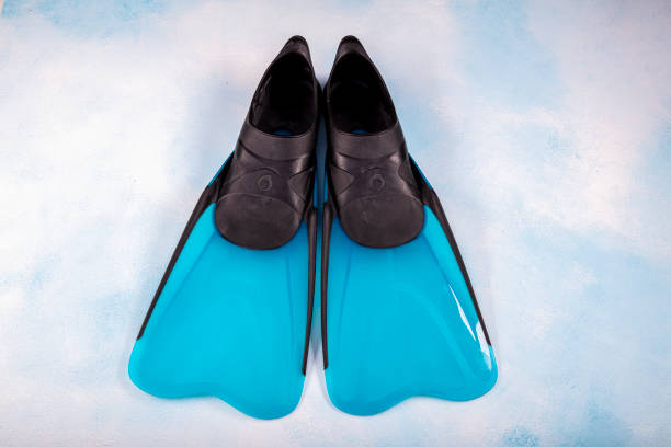 istock Pair of blue flippers (Diver Shoes) isolated on blue ground. 1152184357