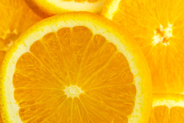 macro of texture slice orange fruit .Close up flesh of orange.