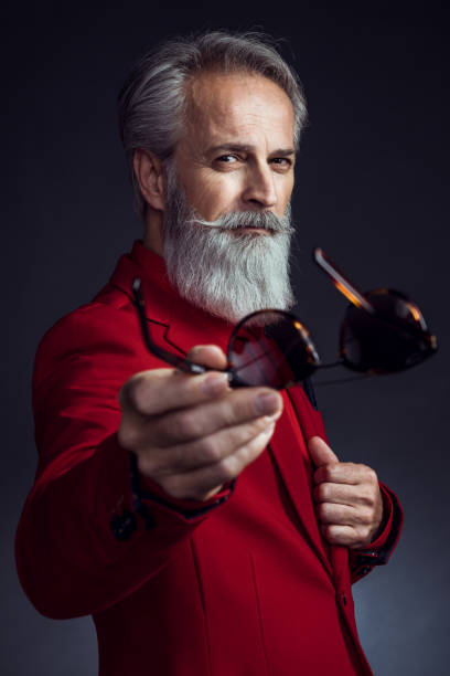 istock Happy well dressed gentleman having photoshooting in studio 1152185660