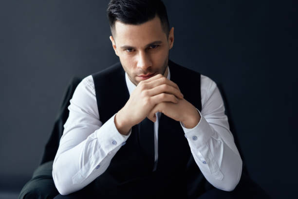 istock Serious and confident man in elegant suit looking to camera 1152187371