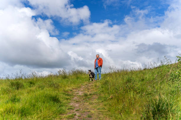 istock Active senior man and dog in countryside 1152187975