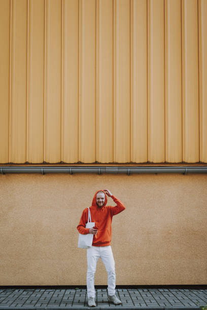 istock Happy smiling hipster man in red fleece on walk 1152188358