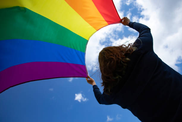istock Young woman with LGBT flag. 1152190882