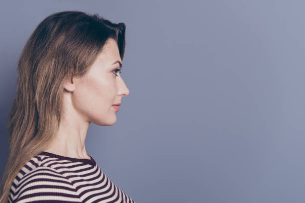 istock Close-up profile side view portrait of her she nice-looking attractive charming pretty wavy-haired lady copy space isolated over gray pastel violet purple background 1152190970