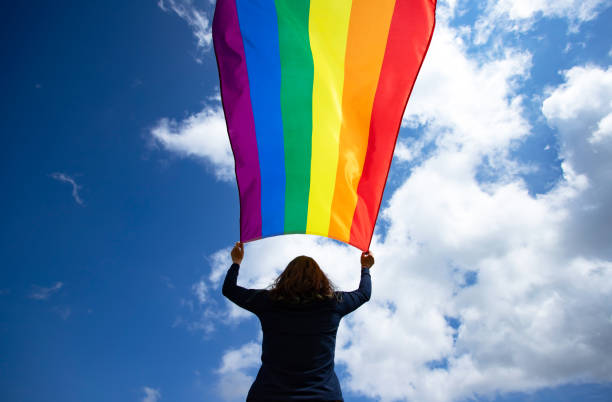istock Young woman with LGBT flag. 1152191043