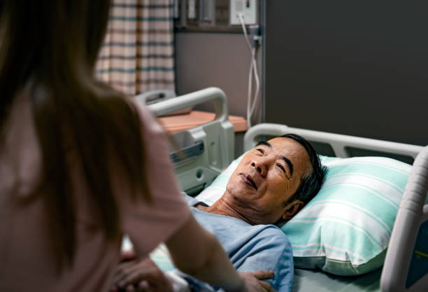 istock Sick male parent smiling while looking at daughter 1152191330