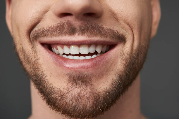 istock Close up of handsome bearded young man posing for camera in studio 1152191812