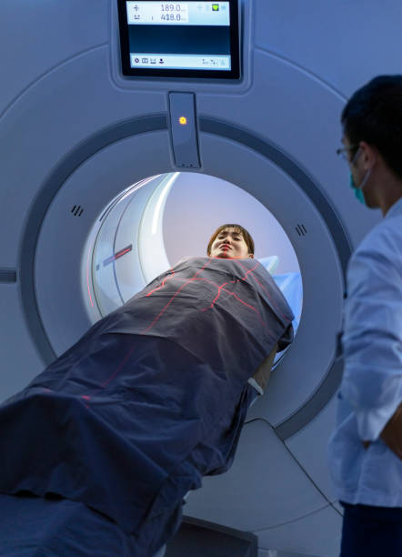 istock Radiologist looking at patient in MRI scanner 1152192017