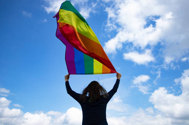 istock Young woman with LGBT flag. 1152192558