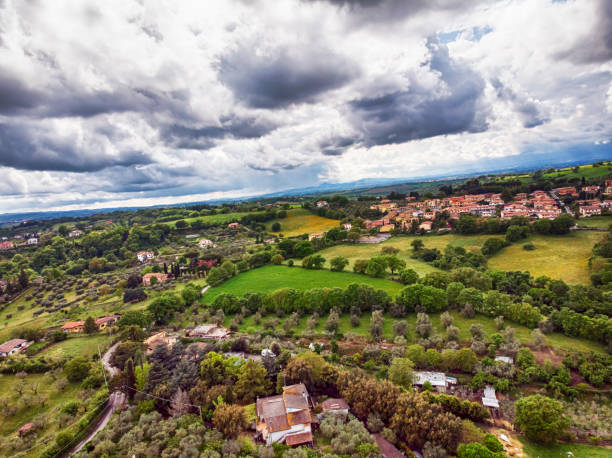 istock Awesome aerial view with green hills, fields planted with fruit trees and meadows 1152194294