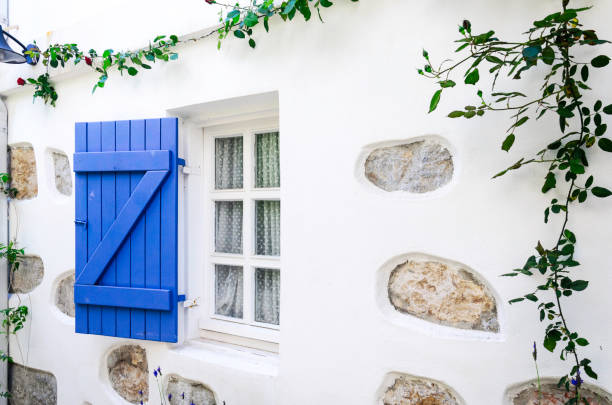 Beautiful vintage window with open blue shutters Vintage window with open blue shutters, Seferihisar, Sigacik stonewall creek stock pictures, royalty-free photos & images