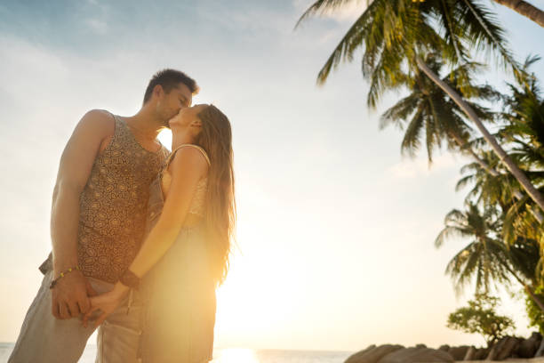 istock couple in love on the beach at sunset 1152195748