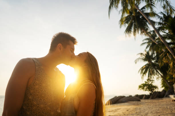 istock couple in love on the beach at sunset 1152195800