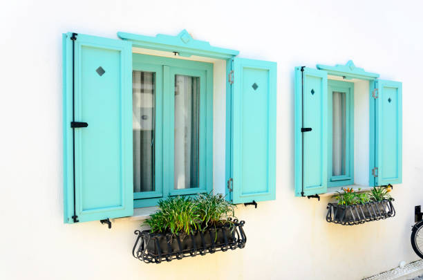 Beautiful vintage window with open Green shutters Beautiful vintage window with open blue shutters, Sigacik, Seferihisar stonewall creek stock pictures, royalty-free photos & images