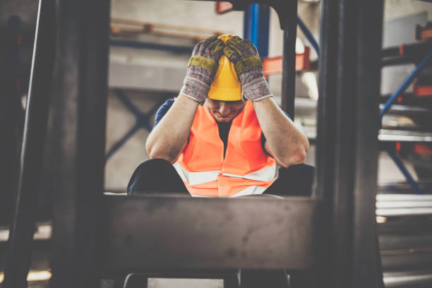 istock Frustrated manual worker in a forklift at warehouse. 1152198661