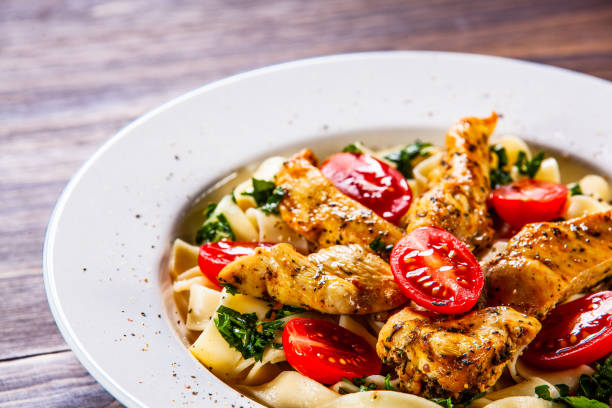 istock Pasta with tomato sauce and chicken nuggets 1152199135