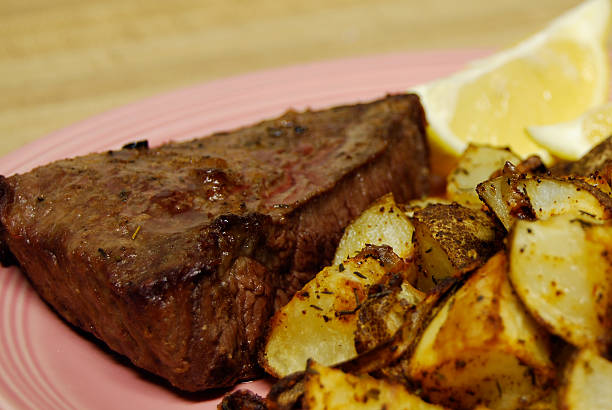 istock Steak with Lemon and Chili-roasted Potatoes 115220043