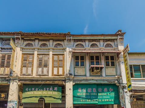 George Town, Penang Island, Malaysia. 8 March 2019. A view of traditional Chinese shophouse architecture in George Town Malaysia.\nThe shophouses of Georgetown are a unique manifestation of overseas Chinese architecture. Combining Chinese designs and principles of feng shui with European building techniques