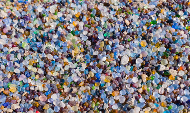 istock colorful glass stone beach background top view 1152201324