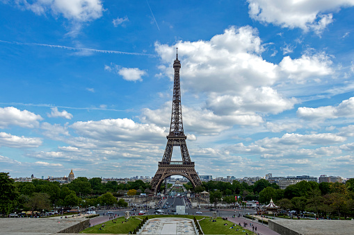 Paris, France - May 16, 2019 : Eiffel Tower or Tour Eiffel, world's most popular tourist attraction, historical monument and symbol of the capital, located on the Champ de Mars in Paris, France