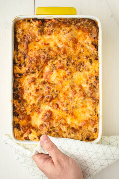istock Lasagna Bolognese with Beef, Cheese and Tomato Sauce on Rustic White Table 1152202614
