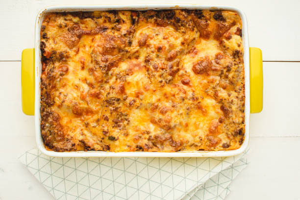 istock Lasagna Bolognese with Beef, Cheese and Tomato Sauce on Rustic White Table 1152202833